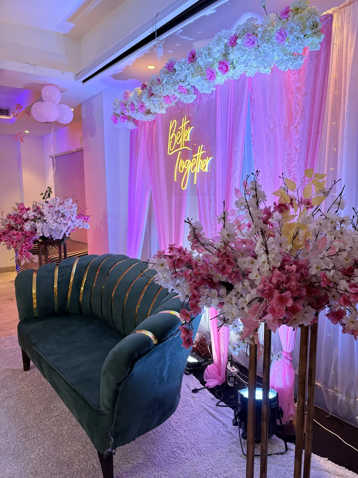 Elegant floral centrepiece on a gold-clothed banquet table at JK Hotel — engagement ceremony venue in C R Park