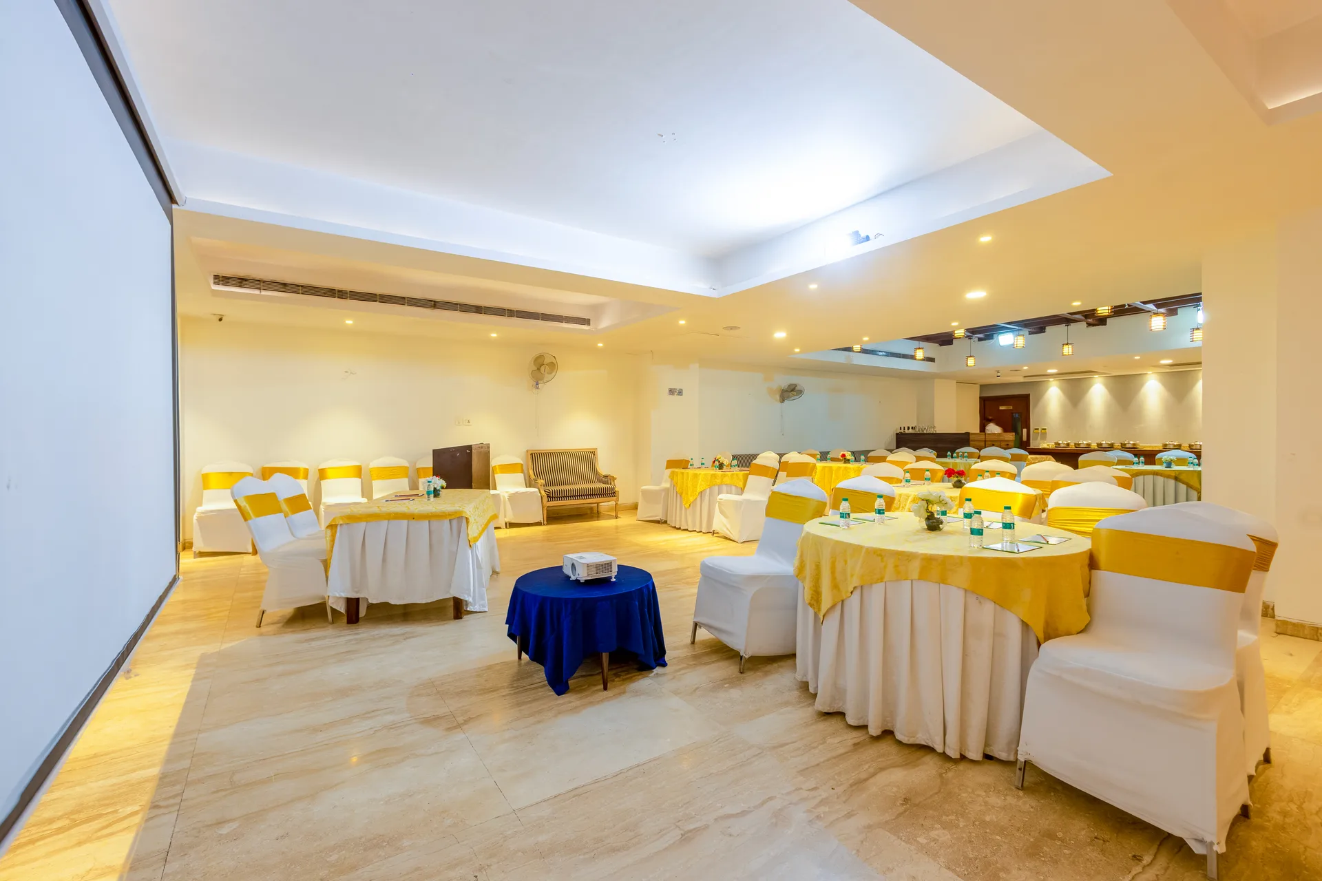 JK Hotel large banquet hall with multiple round tables for events JK Hotel large banquet hall with multiple round tables for events