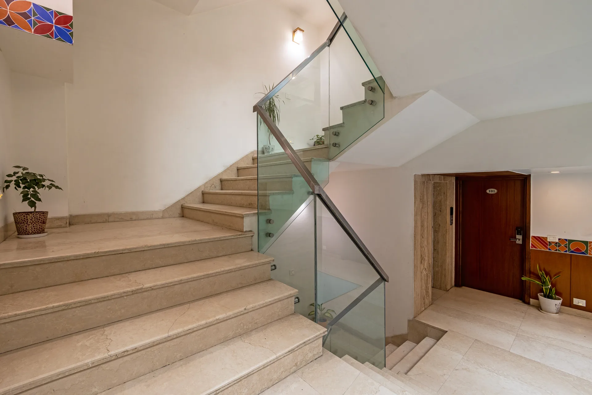 JK Hotel modern staircase with glass railings JK Hotel modern staircase with glass railings