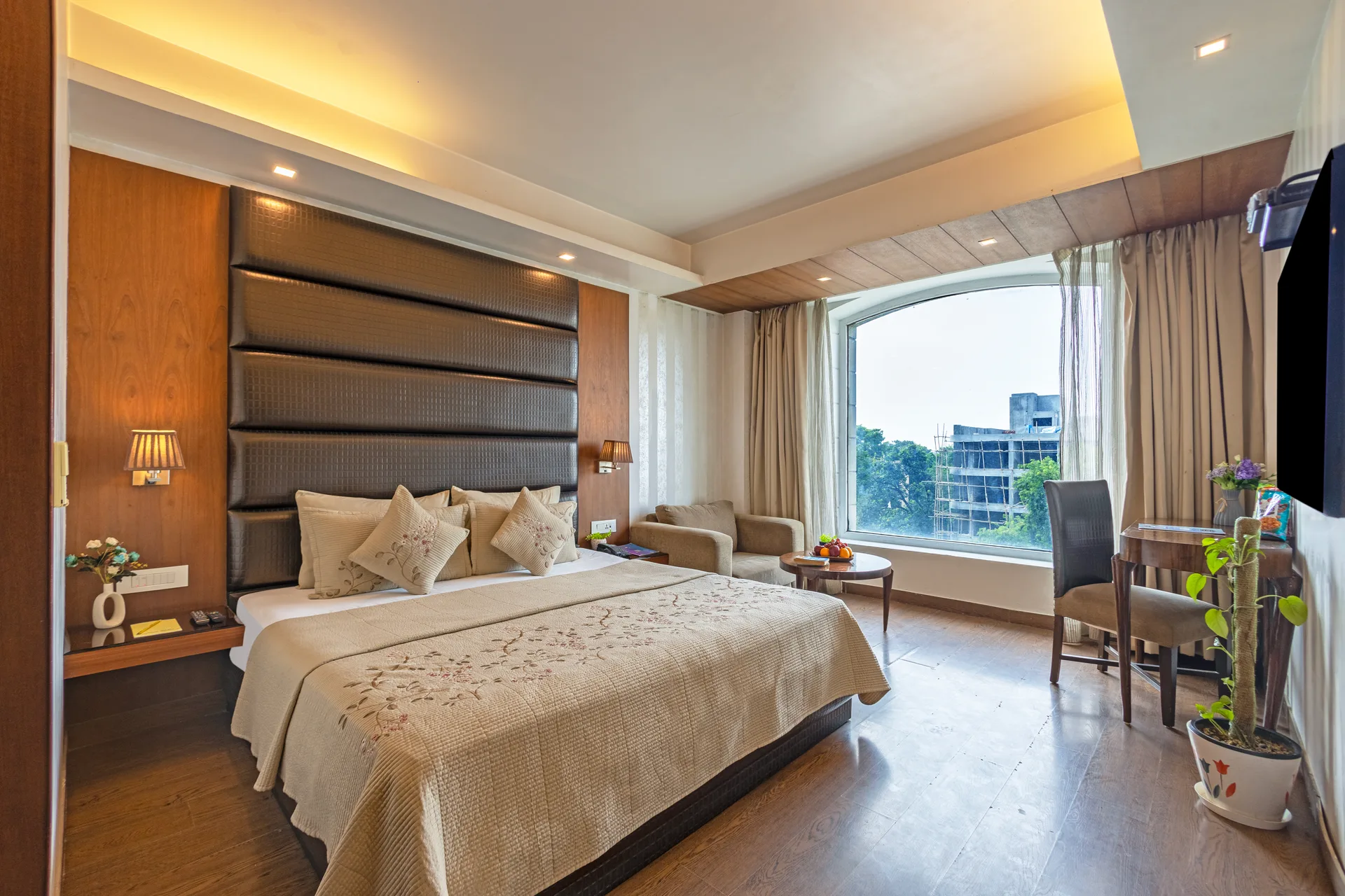 JK Hotel junior suite spacious bedroom with floor-to-ceiling windows JK Hotel junior suite spacious bedroom with floor-to-ceiling windows