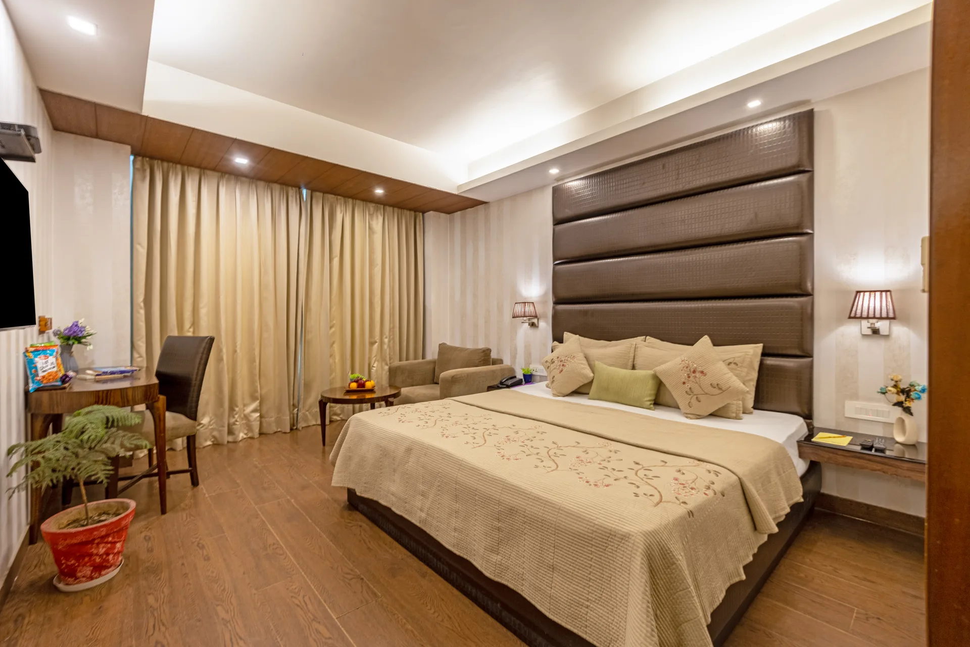 JK Hotel standard room spacious layout with wooden flooring JK Hotel standard room spacious layout with wooden flooring